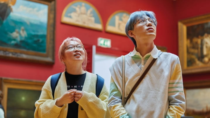 Couple looking at art in an art gallery